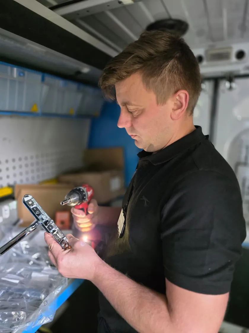 Cornel inspecting door hardware