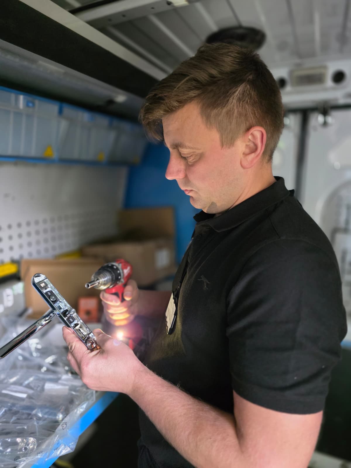 Cornel inspecting door hardware